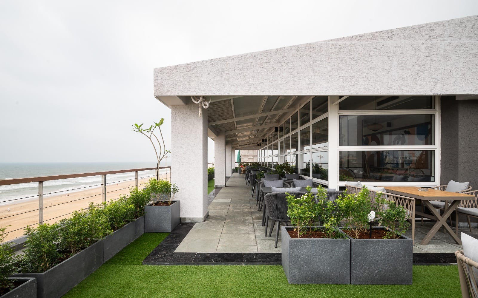 Open-air terrace dining beside the sea