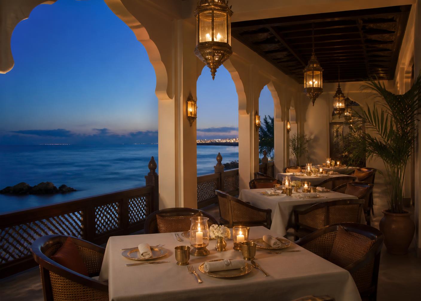 Candlelit sea-facing tables at Nilachal restaurant